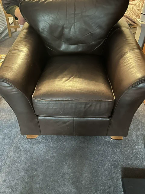 Leather armchair seat cushion restored to a fuller shape