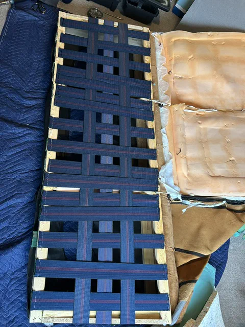 Sofa seat frame fitted with repaired webbing support