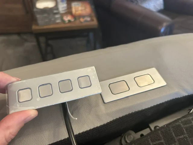 Older two-button electric recliner control before replacement