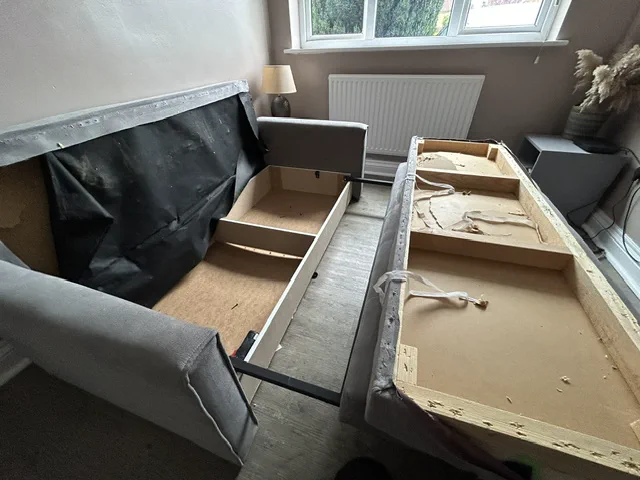 Dismantled sofa seat base before rebuilding