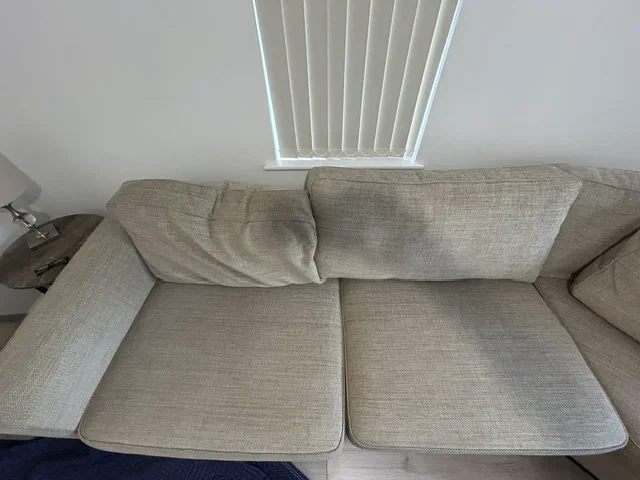 Collapsed sofa back cushions before foam replacement