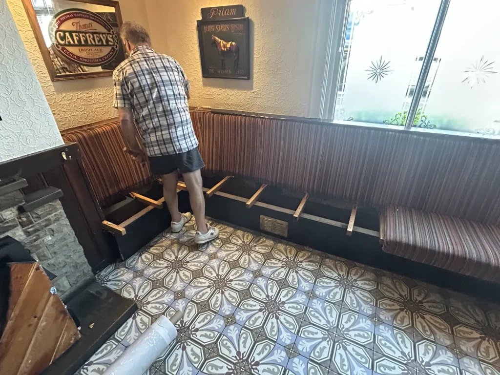 Stripped pub bench seating before rebuilding and reupholstery
